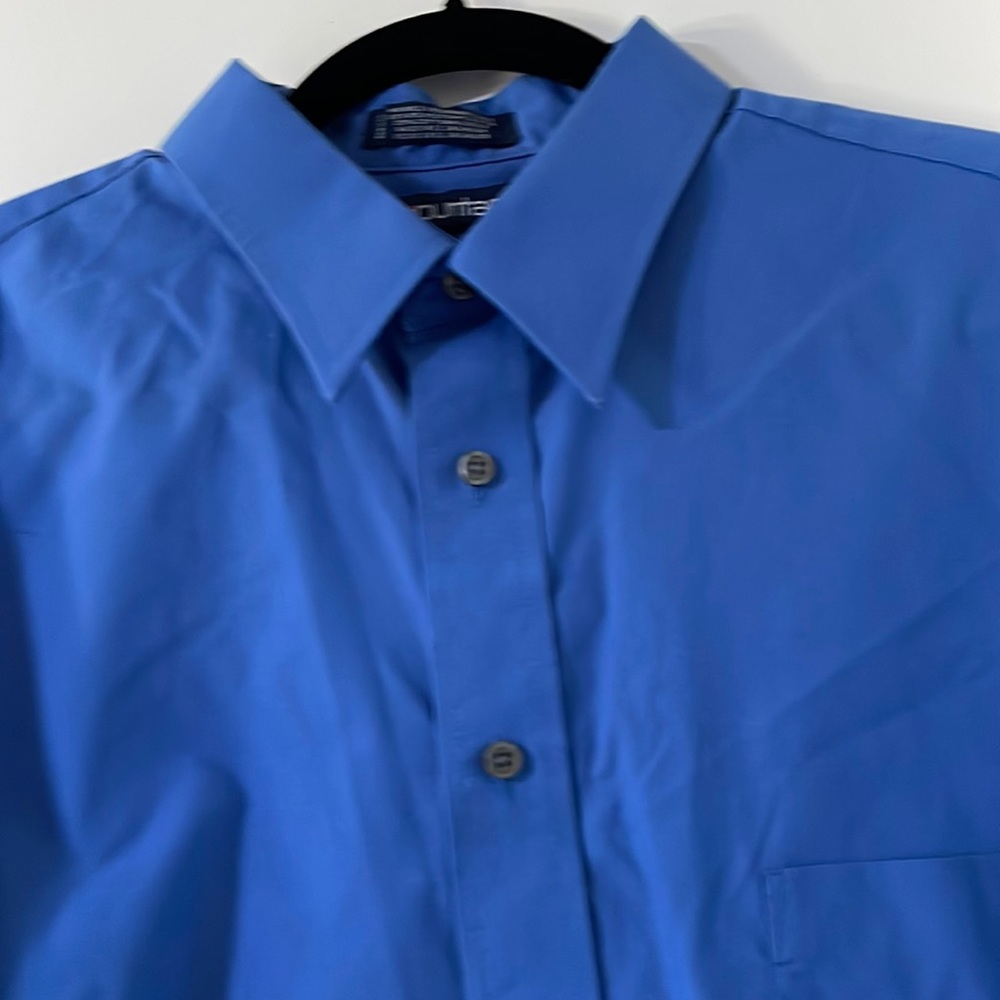 Man Dresses Shirt